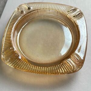 Vintage mid century Carnival glass ashtray. Peach in color.